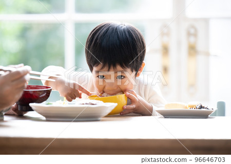 Close-up of a cute toddler eating rice hard 96646703