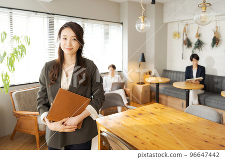 A woman working in a casual office A woman working in a casual office 96647442