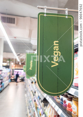 Signage word of Vegan food in supermarket grocery aisle 96647692