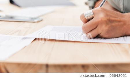 close up. business woman writing while sitting at the table close up. business woman writing while sitting at the table 96648061
