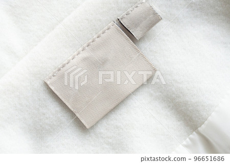 laundry care clothing label on fabric texture 96651686