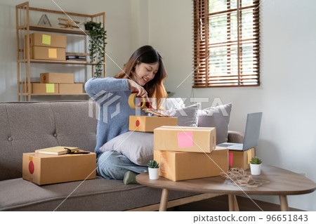 Startup small business, Young woman working freelance and packing box delivery products to customers, Ordered online 96651843