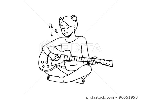 Smiling girl playing guitar 96651958