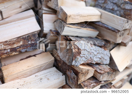 Lot of chopped pine wood stacked neatly closeup background Lot of chopped pine wood stacked neatly closeup background 96652005