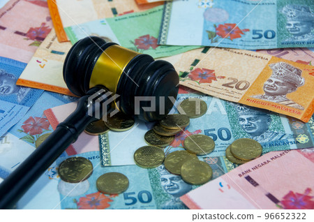 Various Malaysia Ringgit currency and coins with gavel. Money concept. Various Malaysia Ringgit currency and coins with gavel. Money concept. 96652322