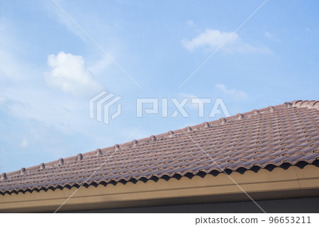 Ceramic roof tiles on the house with blue sky Ceramic roof tiles on the house with blue sky 96653211