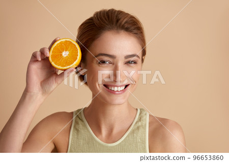 Laughing Girl Hold Slices of Orange. Happy Woman Recommended Vitamin for Skin 96653860