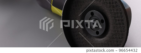 Electrical saw, grinder with nozzle on grey surface, detailed picture of powerful circular saw tool Electrical saw, grinder with nozzle on grey surface, detailed picture of powerful circular saw tool 96654432