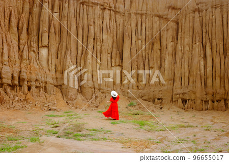Women and landscape of soil textures eroded sandstone pillars, columns and cliffs, natural erosion of water and wind, Sao Din Na Noi, Hom Chom, Khok Suea at sri nan national park in Nan Province. Women and landscape of soil textures eroded sandstone pillars, columns and cliffs, natural erosion of water and wind, Sao Din Na Noi, Hom Chom, Khok Suea at sri nan national park in Nan Province. 96655017