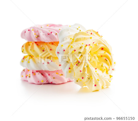 Different colors meringues with sprinkles isolated on white background. Different colors meringues with sprinkles isolated on white background. 96655150