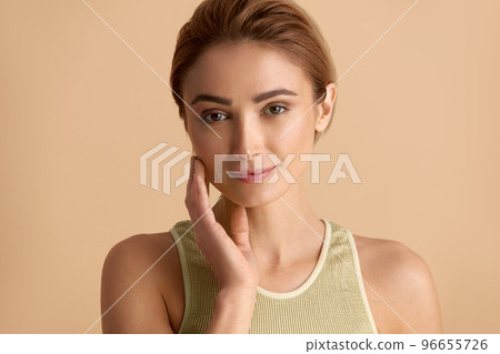 Smiling Woman Touching Face. Waist Up Portrait of Woman Touching Her Skin Smiling Woman Touching Face. Waist Up Portrait of Woman Touching Her Skin 96655726