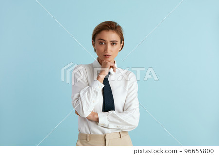 Serious Businesswoman Posing Studio. Portrait of Thoughtful Woman Standing 96655800