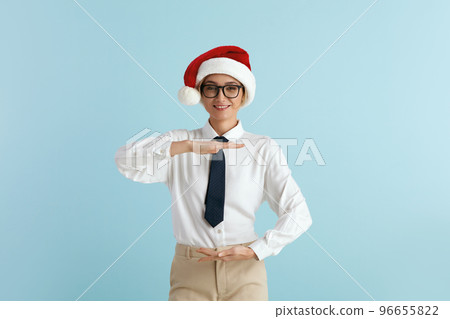 Surprised Businesswoman Showing Big Size. Satisfied Caucasian Lady in Santa Hat 96655822
