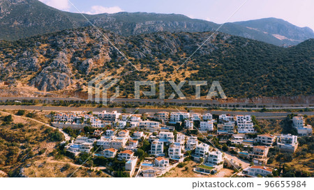 Mountains and cityscape of coastal town. Aerial panoramic view from drone. Kas, Antalya province, Turkey. 96655984