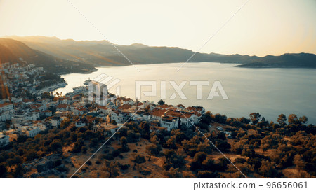 Sunset view of sea and resort town. Beautiful nature panorama from above. Travel and vacation concept. Sunset view of sea and resort town. Beautiful nature panorama from above. Travel and vacation concept. 96656061
