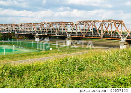 Yodogawa Bridge on the Osaka Higashi Line over the Yodo River in Asahi Ward, Osaka City 96657163