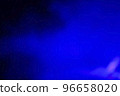 Blurred dark background with blue smoke light. 96658020