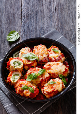 tasty chicken rollatini in tomato sauce, top view tasty chicken rollatini in tomato sauce, top view 96658860