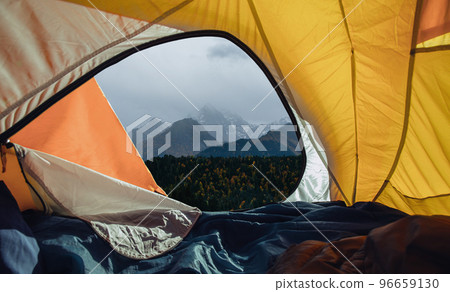 View from tent to snowy mountains in the morning View from tent to snowy mountains in the morning 96659130
