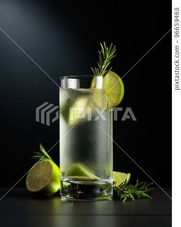 Cold refreshing drink with ice, lime, and rosemary. 96659468