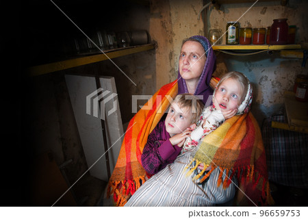 Frightened children with their mother hide in the cellar from the bombings. Kyiv. Ukraine. 8 May 2022 96659753