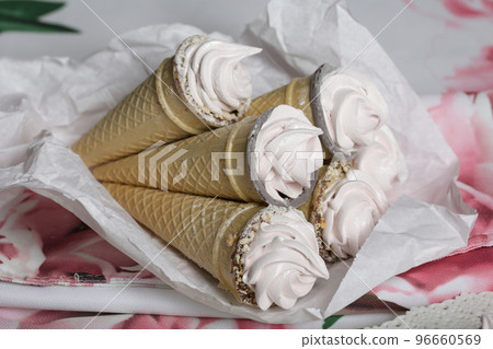 Homemade marshmallows in waffle cones. Homemade zephyr. Homemade marshmallows in waffle cones. Homemade zephyr. 96660569