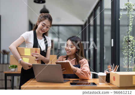 Two Asian woman working together for SME project. Young Owner people startup for Business Online, SME, Delivery Project. Online Business and Small business Concept 96661212
