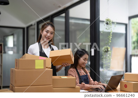 Two Asian woman working together for SME project. Young Owner people startup for Business Online, SME, Delivery Project. Online Business and Small business Concept 96661240