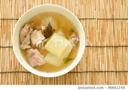 boiled winter melon with pork bone and black mushroom soup on bowl boiled winter melon with pork bone and black mushroom soup on bowl 96662148