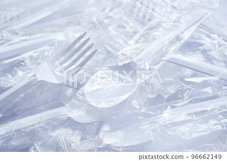 plastic spoon and fork for single used in transparent packaging arranging on white background plastic spoon and fork for single used in transparent packaging arranging on white background 96662149