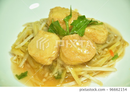 fried white garlic chive with slice yellow egg tofu and chop pork on plate 96662154