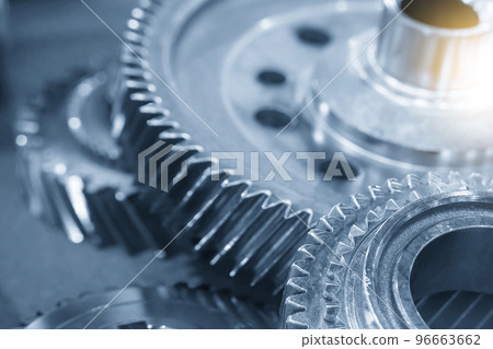 Close-up scene of transmission  gear spare parts in the light blue scene with lighting effect. 96663662