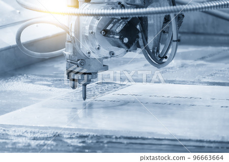 Close-up scene of multi-axis abrasive waterjet cutting machine cutting the aluminum plate. Close-up scene of multi-axis abrasive waterjet cutting machine cutting the aluminum plate. 96663664