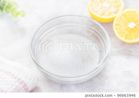 Citric acid and lemon in a glass vessel Citric acid and lemon in a glass vessel 96663946