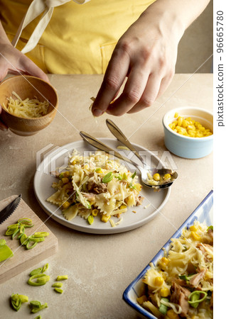 Tuna Pasta Bake with sweet corn. One pan easy, comfort food, warm lifestyle background. 96665780