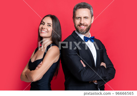 studio shot of glad formal tuxedo couple. elegant couple wear formal tuxedo. formal tuxedo couple studio shot of glad formal tuxedo couple. elegant couple wear formal tuxedo. formal tuxedo couple 96666565
