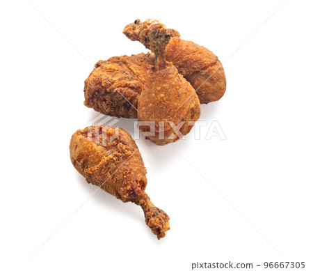 Grilled chicken legs with spices and garlic in close-up isolated on white background with shadow Grilled chicken legs with spices and garlic in close-up isolated on white background with shadow 96667305