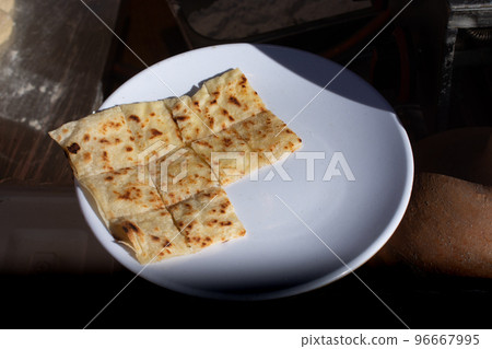 Making of traditional turkish gozleme pancake Making of traditional turkish gozleme pancake 96667995
