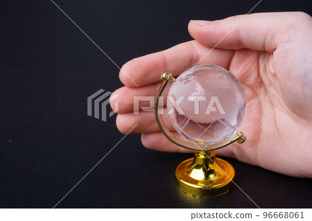 Hands protecting the globe against the global risks and dangers Hands protecting the globe against the global risks and dangers 96668061