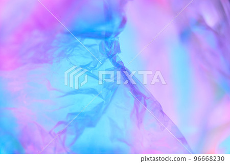 Transparent holographic wrinkled polyethylene background. Holographic colorful plastic film in blue, purple and pink tones with copy space. High quality photo Transparent holographic wrinkled polyethylene background. Holographic colorful plastic film in blue, purple and pink tones with copy space. High quality photo 96668230