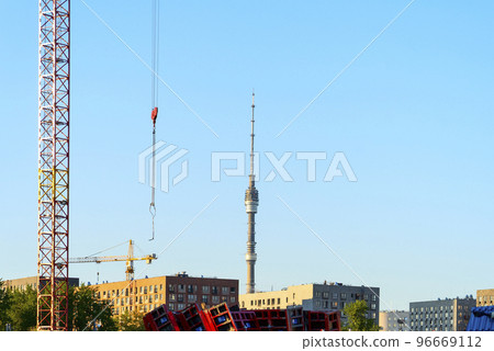 ,tower crane against the sky and Ostankino TV tower ,tower crane against the sky and Ostankino TV tower 96669112
