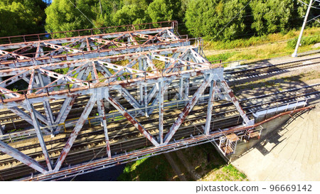 railway bridge over a small river close-up view from above, bright colorful photo 96669142