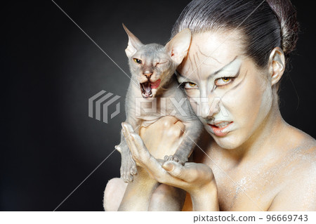 european model in cat make-up and bodyart 96669743