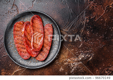 Grilled Turkish Sucuk meat sausage. Dark background. Top view. Copy space Grilled Turkish Sucuk meat sausage. Dark background. Top view. Copy space 96670149