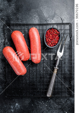 Turkish Sucuk beef meat sausage. Black background. Top view 96670196