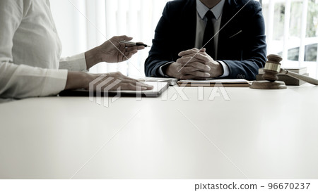 Lawyer are listening to reports from associates or clients Lawyer are listening to reports from associates or clients 96670237