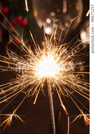 New Year celebration. Bright sparkler on festive night. New Year celebration. Bright sparkler on festive night. 96671257