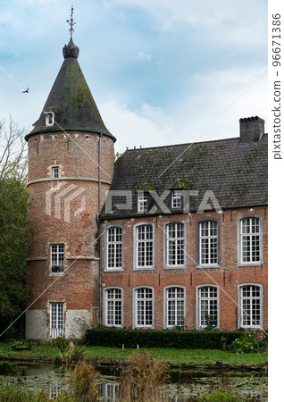 Ternat, Flemish Brabant Region, Belgium, Tower and facade of the brick stone Kruikeburg castle and pond 96671386
