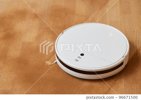 Robot vacuum cleaner cleans the very dirty dusty floor of the apartment at a certain time. Robot vacuum cleaner cleans the very dirty dusty floor of the apartment at a certain time. 96671500