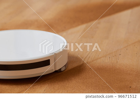 Robot vacuum cleaner cleans the very dirty dusty floor of the apartment at a certain time. 96671512
